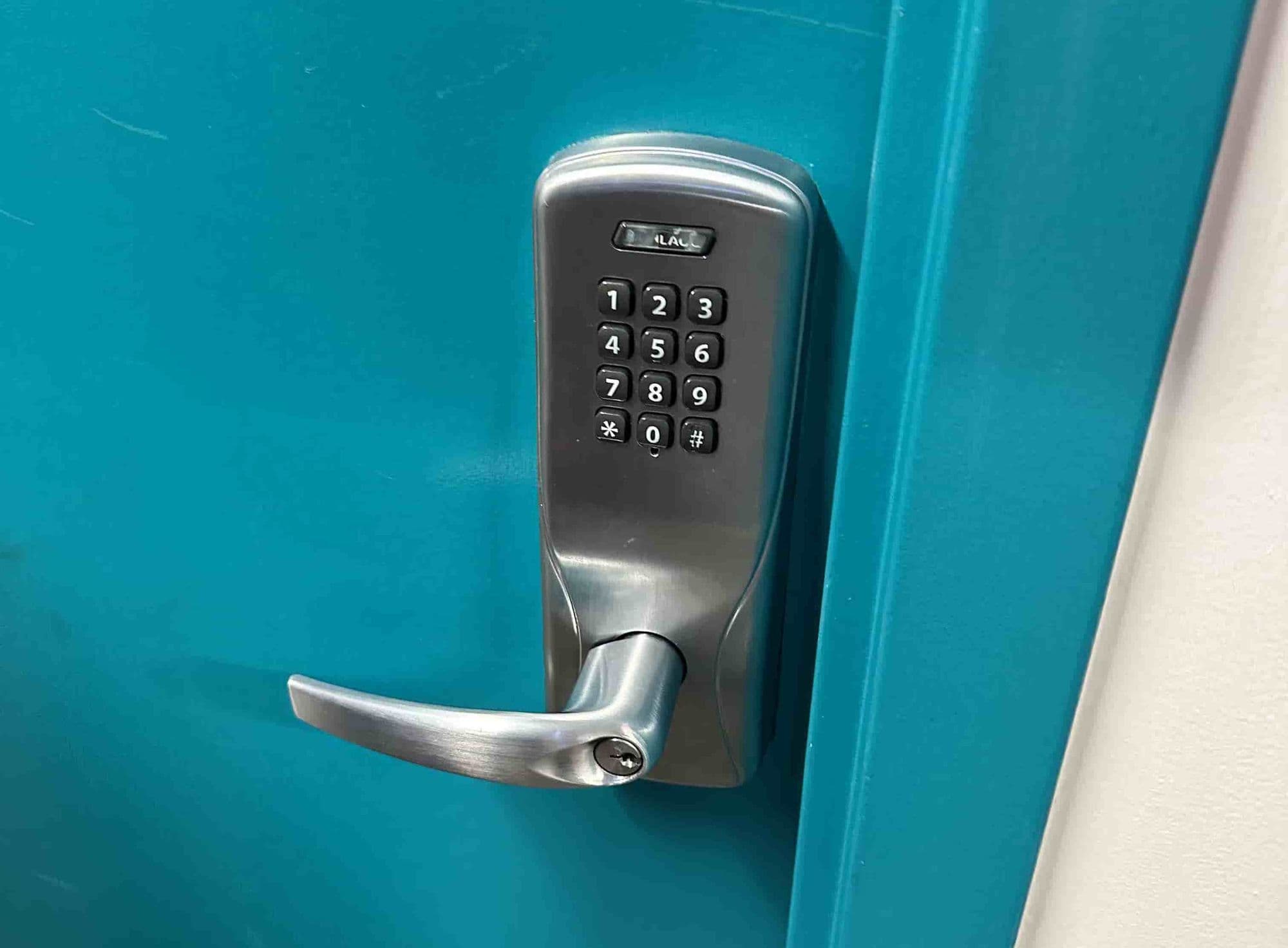 Keypad lever lock installed on a commercial door
