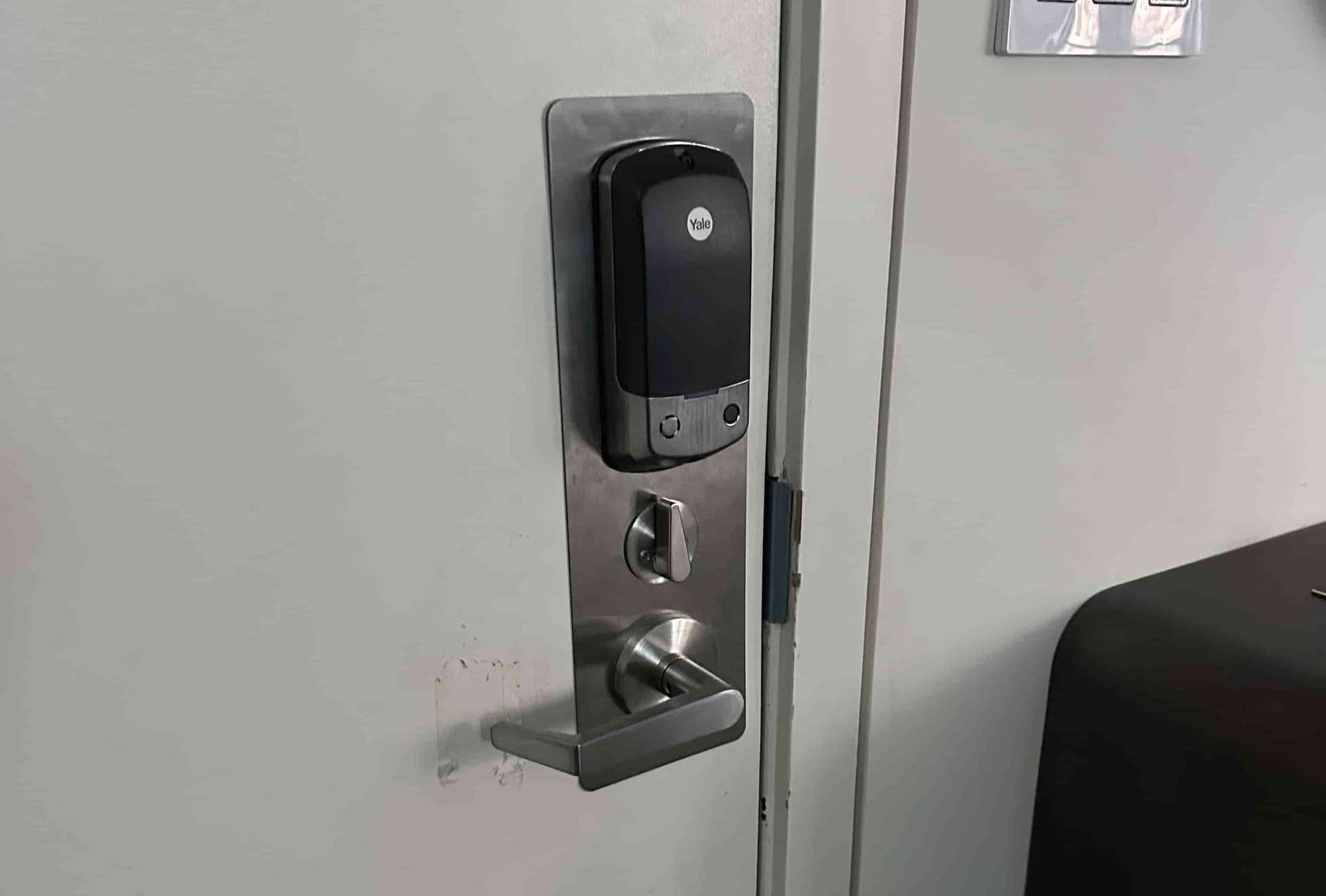 Smart keypad deadbolt installed on a residential door